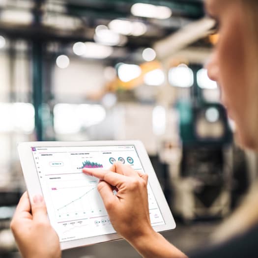 Worker using shop floor software on tablet